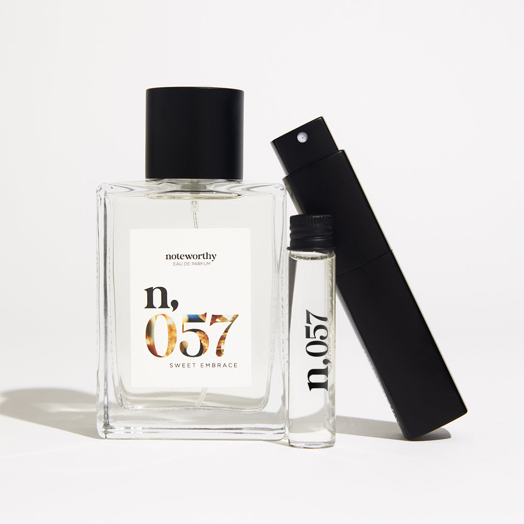 Bottle 100 ml and Compact travel-size bottle of Noteworthy n,057 Eau de Parfum.