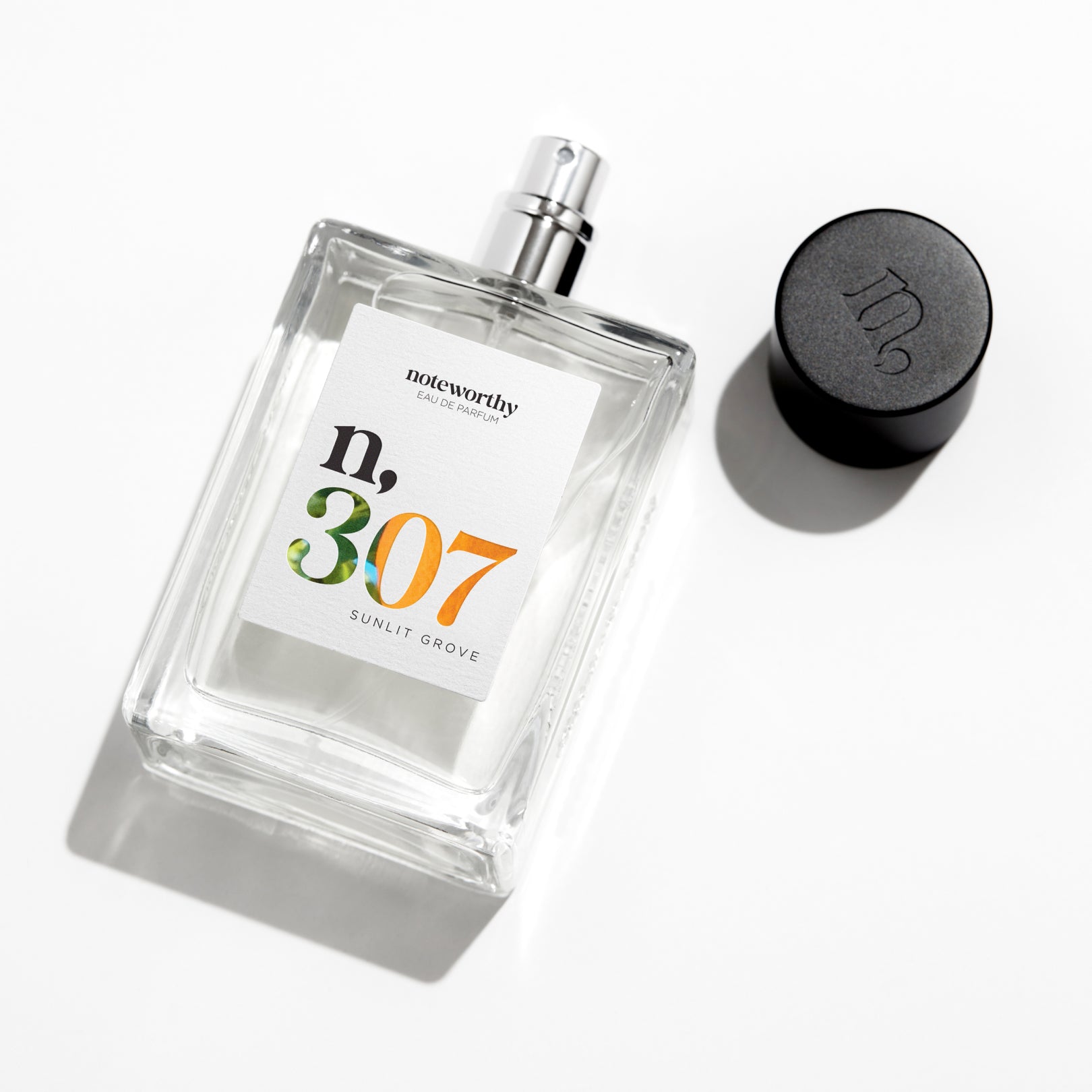 Mandarin, Woody Eau De Parfum n,307 in 100ml bottle, representing invigorating citrus and warm sandalwood notes